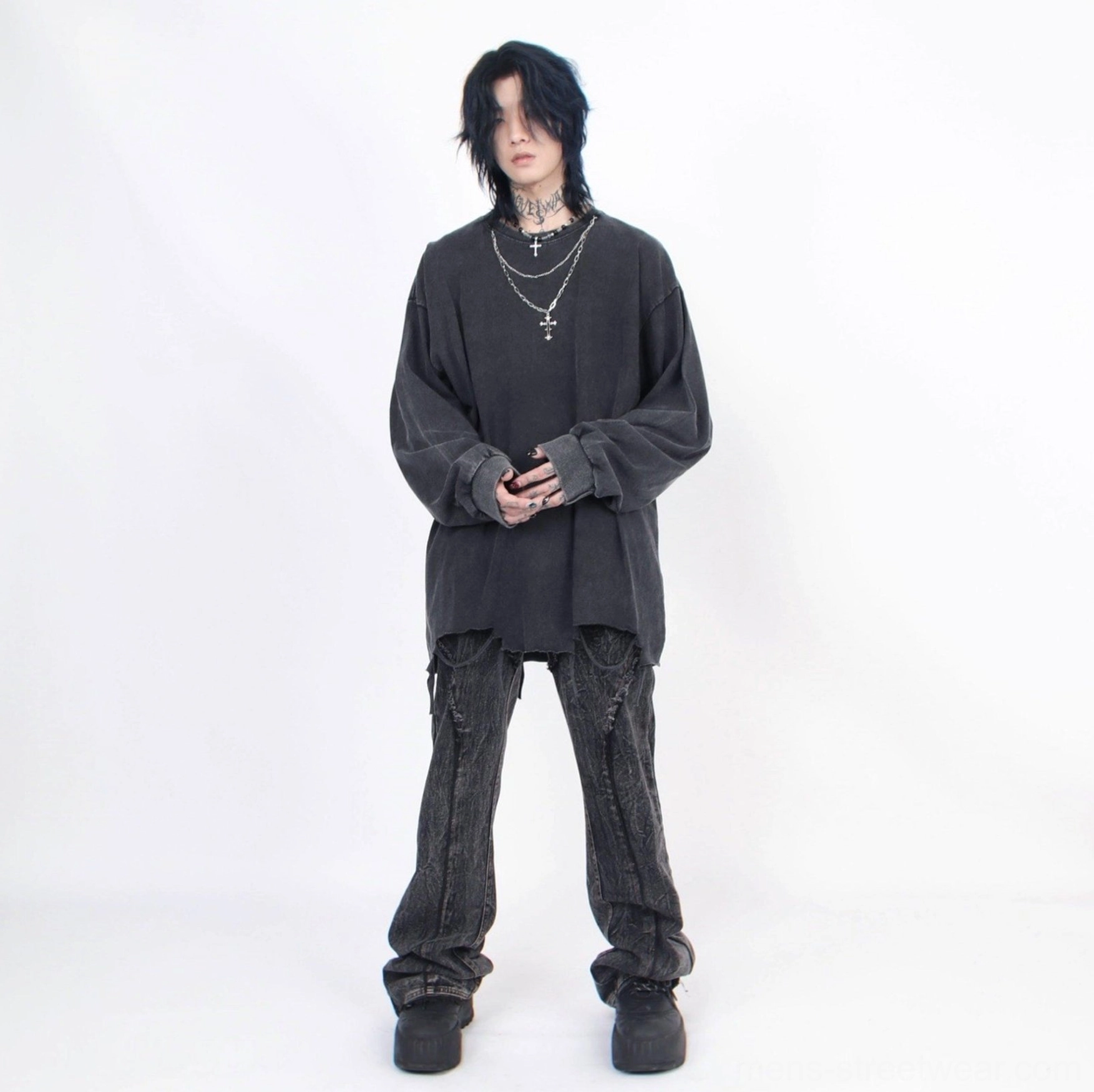 Full front view of men's distressed oversized long-sleeve streetwear tee styled with cross necklace
