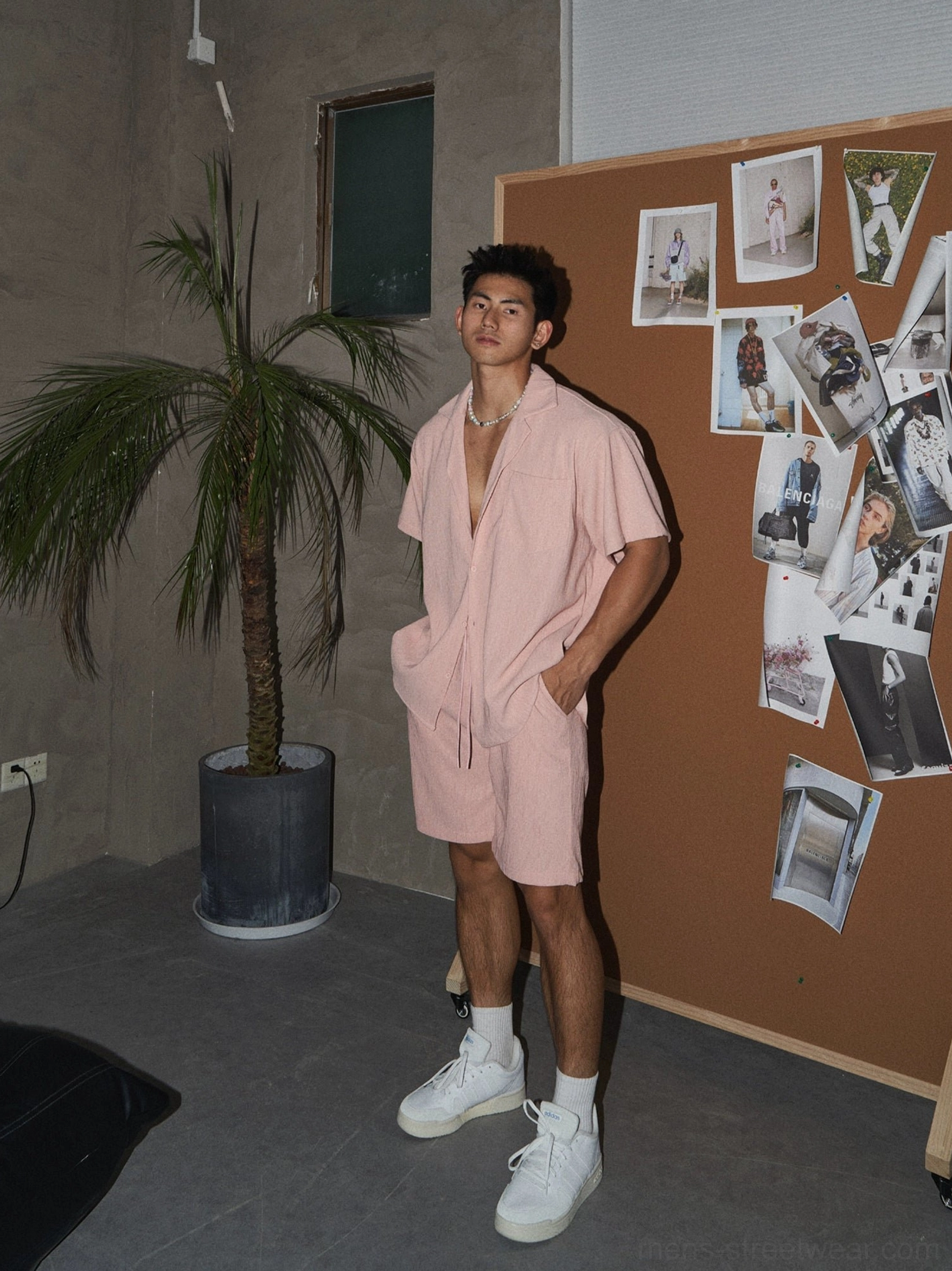 Men's dusty pink textured woven shirt and drawstring shorts two-piece streetwear outfit side view