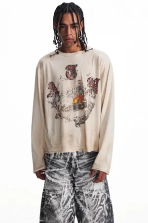 Close front view of men's faded apricot crew neck long sleeve graphic streetwear t-shirt with retro print