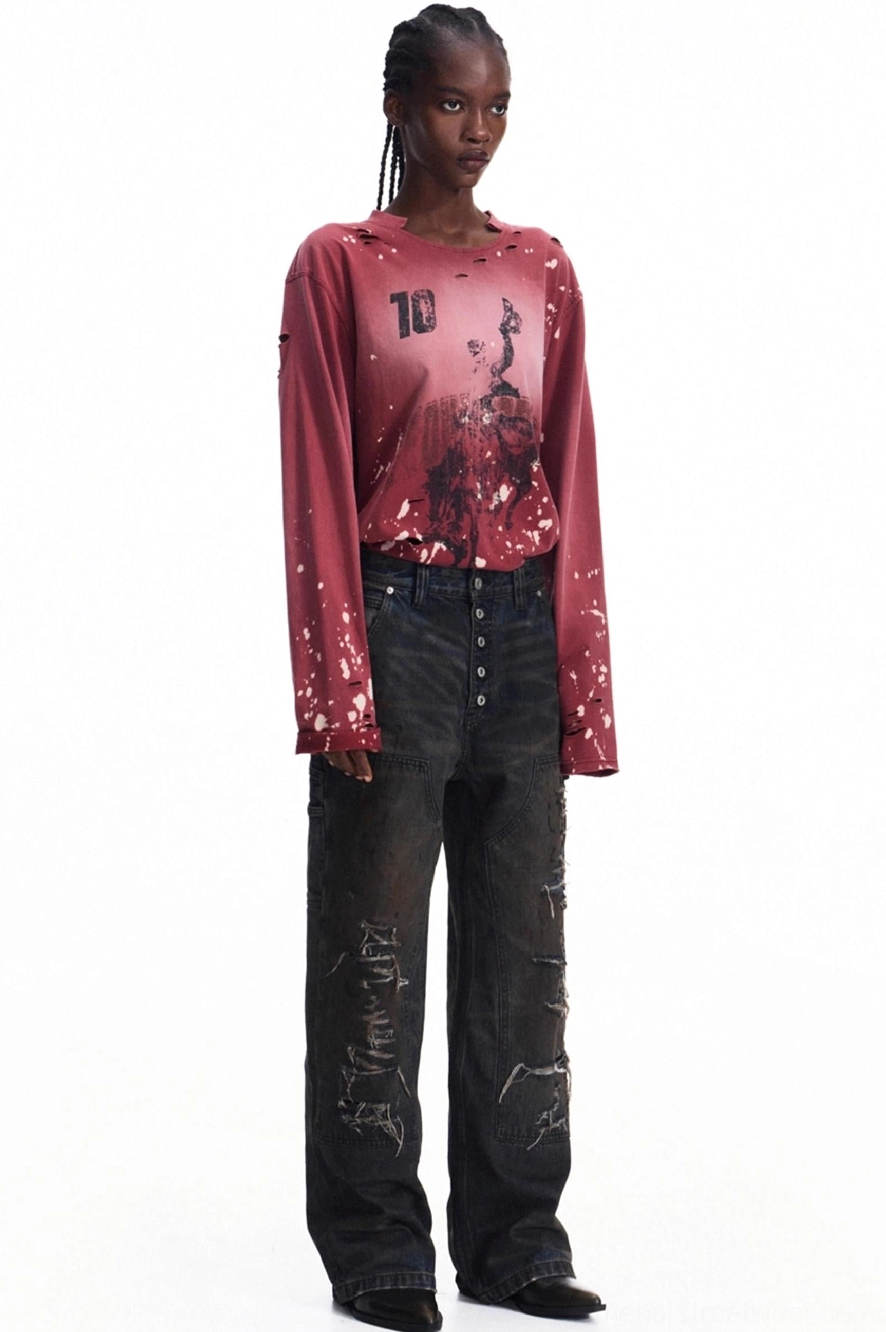 Full side view of a men's faded burgundy long-sleeve streetwear graphic T-shirt with number 10 front print, abstract artwork, distressed cuffs, and relaxed silhouette