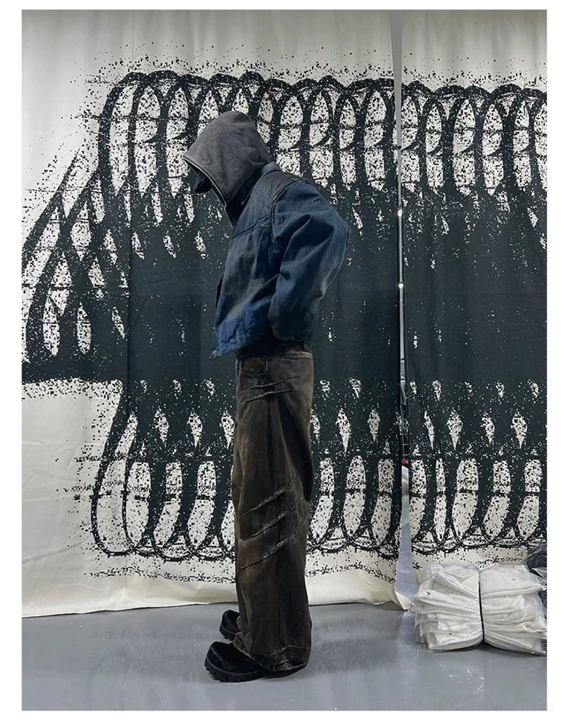 Side back view of oversized faded indigo panel denim trucker jacket styled with dark washed wide-leg jeans and hood