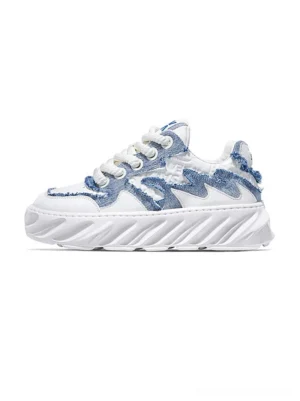 Blue and white frayed wave chunky sneakers with distressed denim-style panels, layered streetwear upper, and thick white rubber sole