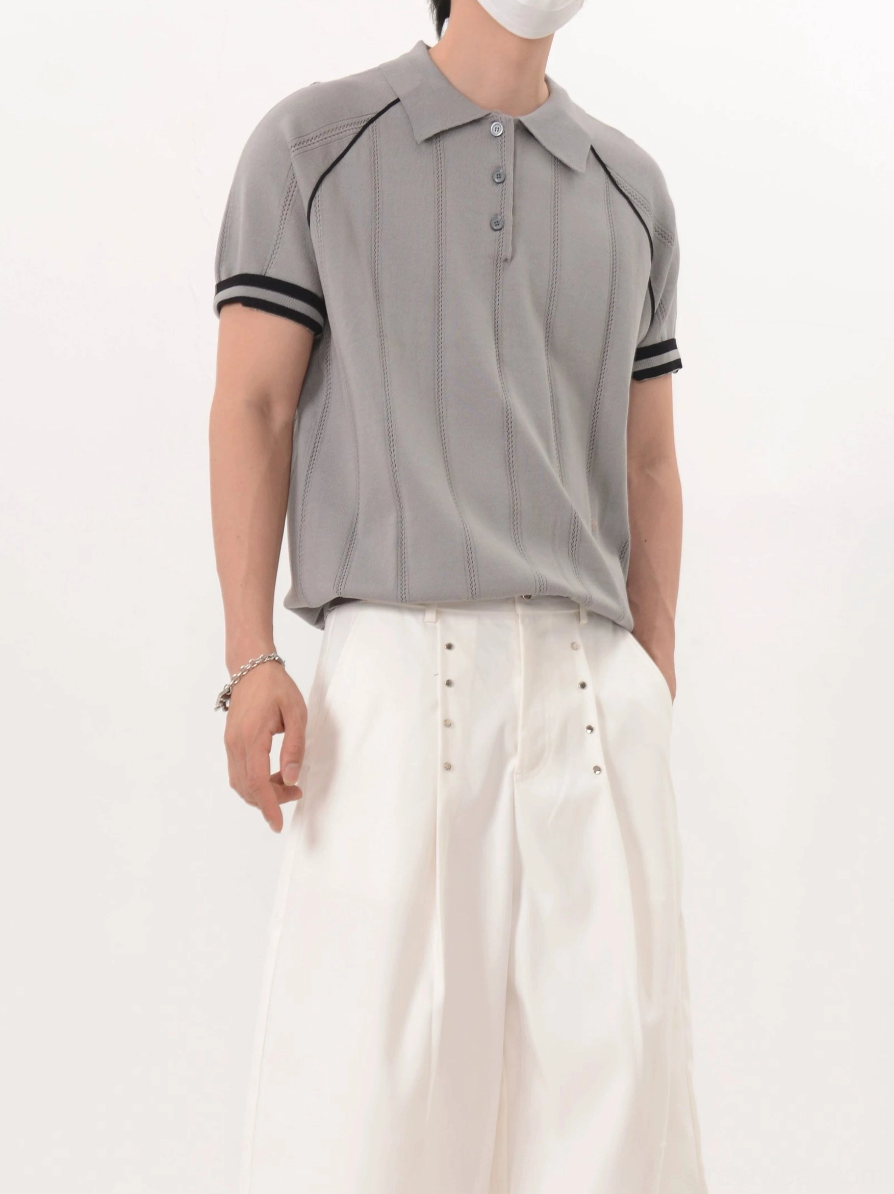 Men's gray vertical texture knit polo shirt with contrast shoulder piping and four-button collar