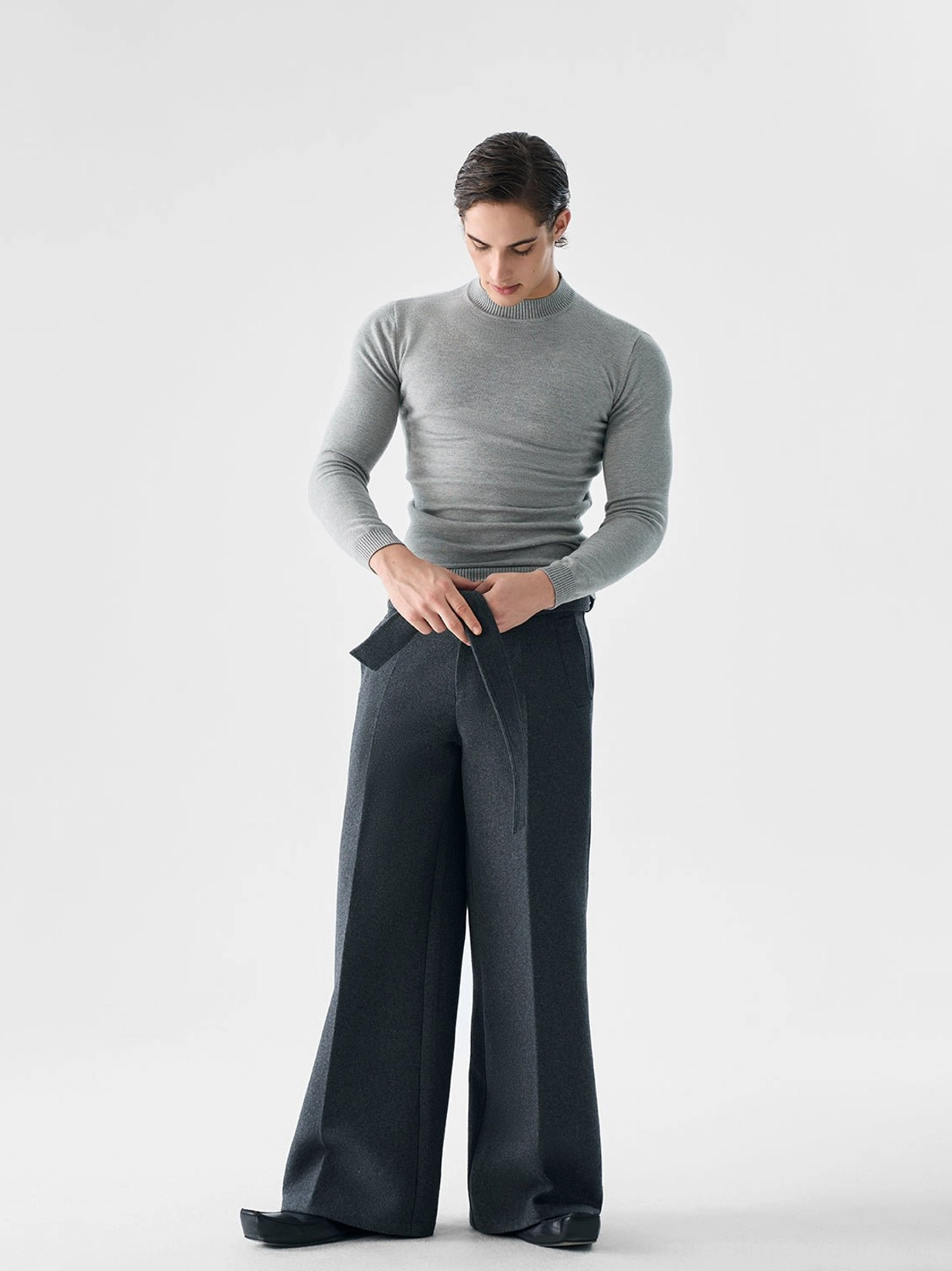 Men's heather gray slim fit mock neck knit sweater three quarter front view in Korean minimalist streetwear outfit
