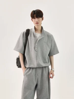 Men's heather grey stand collar polo and wide-leg trousers outfit with relaxed Seoul streetwear silhouette