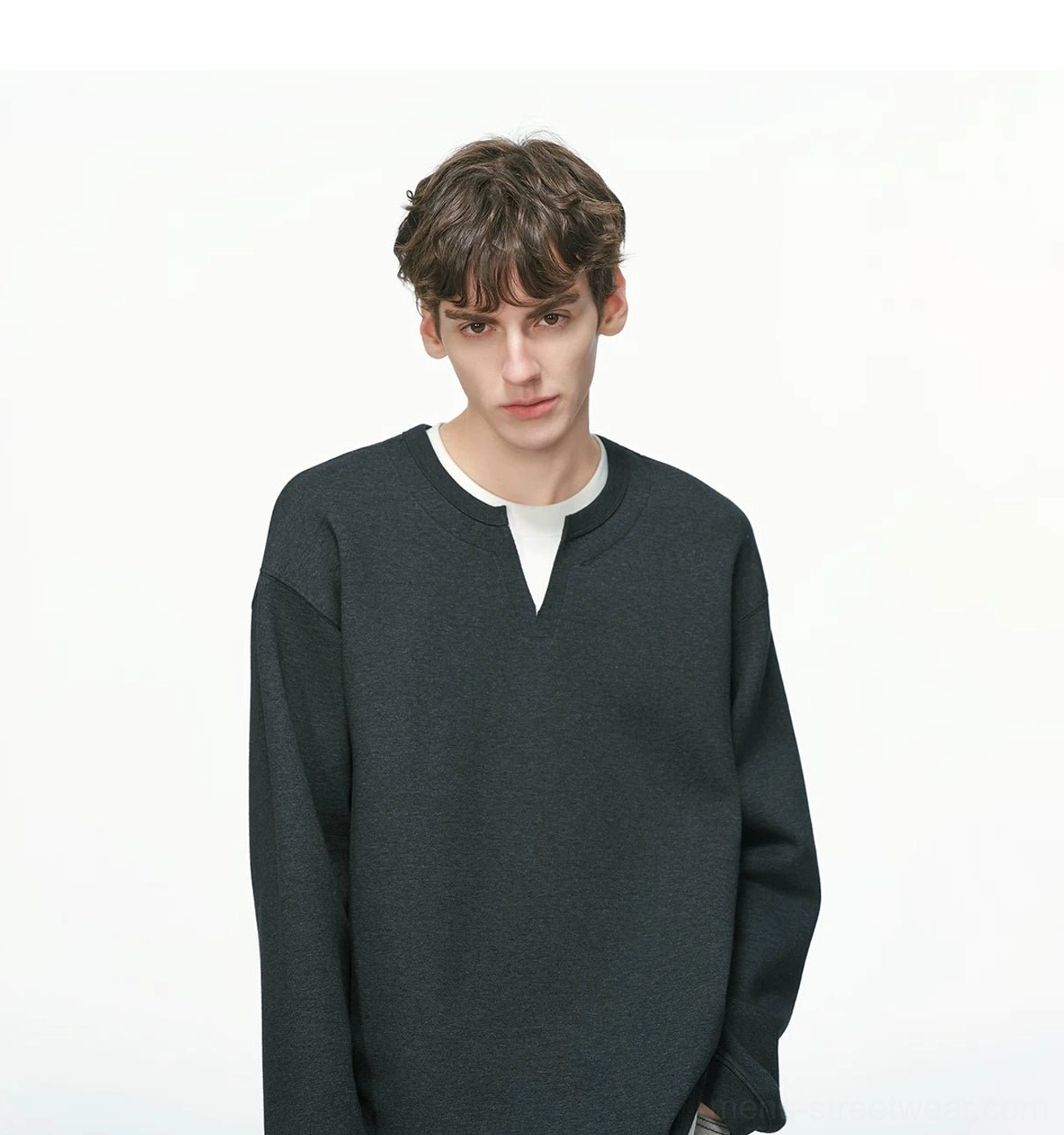 Modern men's layered crew neck pullover with slightly cropped body, contrast white trim, and versatile everyday streetwear design