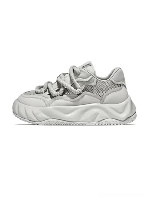 Light grey men's chunky platform sneakers with mixed mesh and leather upper, thick flat laces, sculpted wavy outsole, and contemporary streetwear design