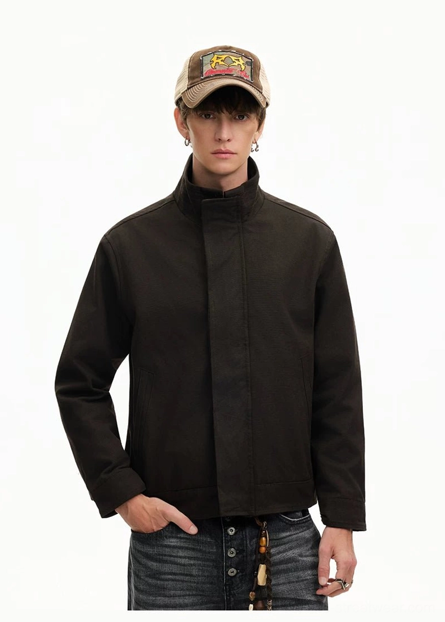 Men's minimal Harrington jacket close-up showing practical vertical welt side pocket construction