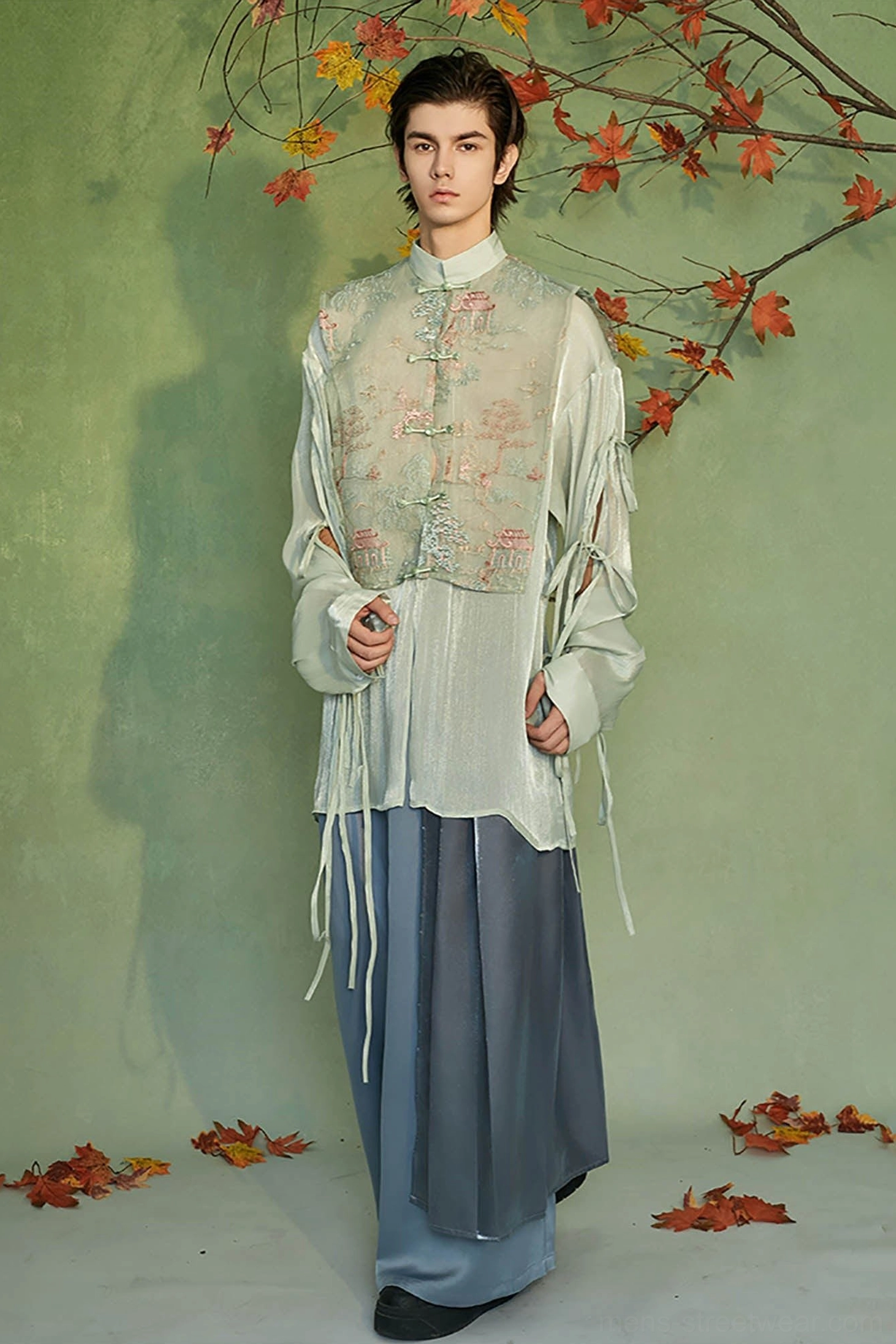 Full body styling of mint green embroidered Hanfu vest layer jacket with wide leg blue trousers