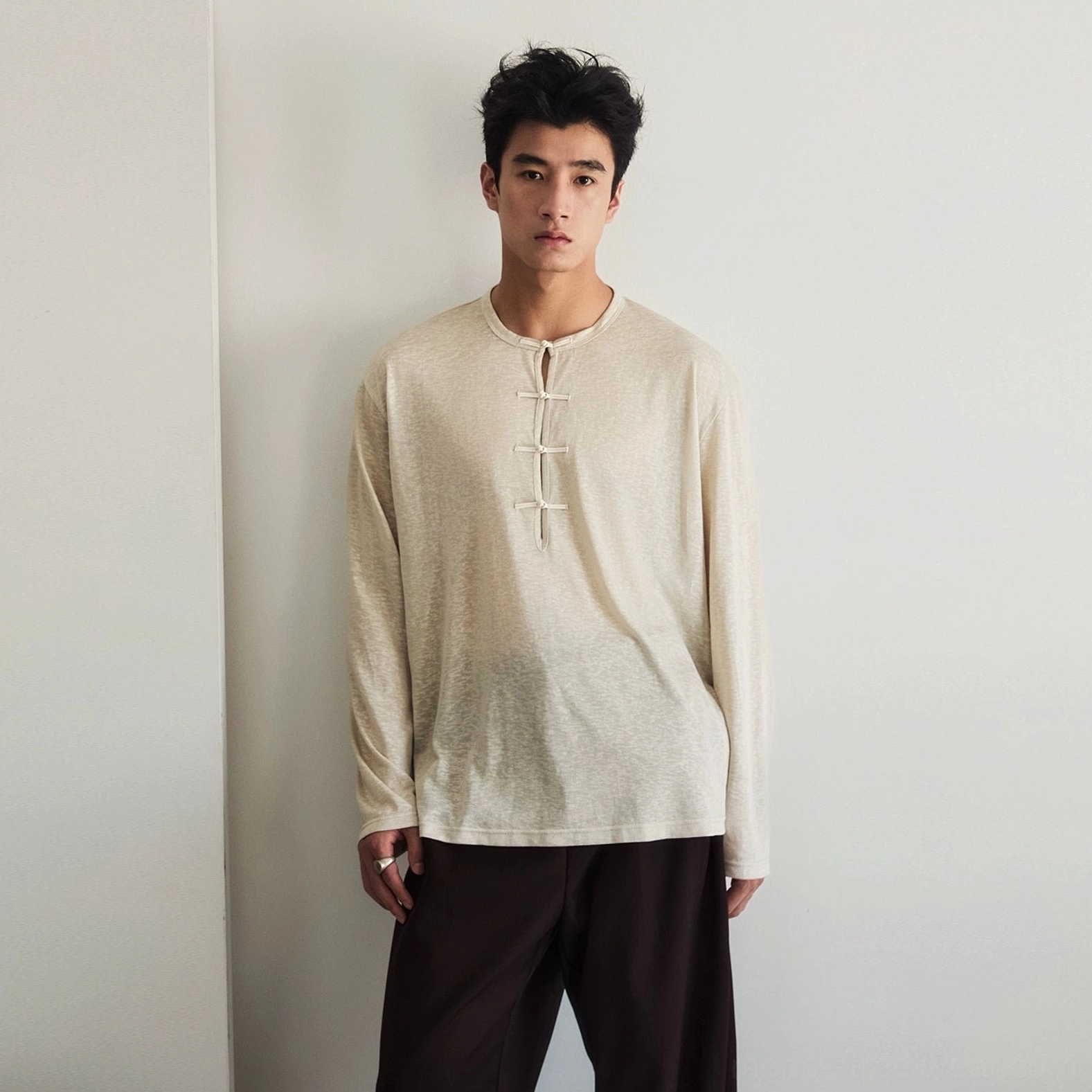 Men's oatmeal beige relaxed fit silk blend long sleeve Henley tee with Chinese inspired frog button front detail