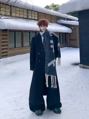 Men's oversized black long overcoat with wide shoulders and double-breasted tailoring front full body view