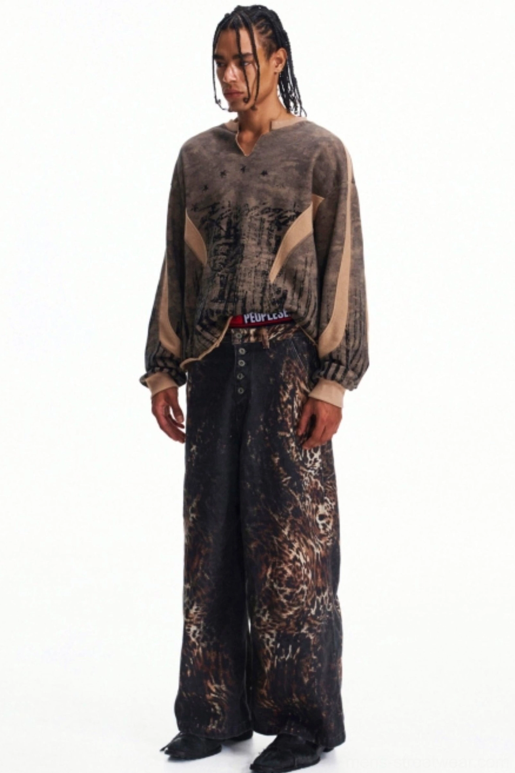 Side front view of oversized men's camouflage half-zip top with relaxed masculine Korean streetwear fit