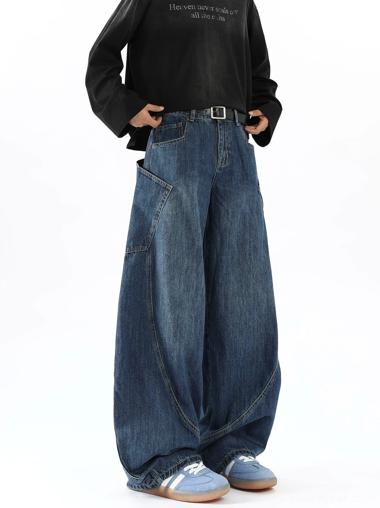 Men's oversized vintage blue balloon jeans left profile showing side cargo utility pocket curved seam construction and wide legs