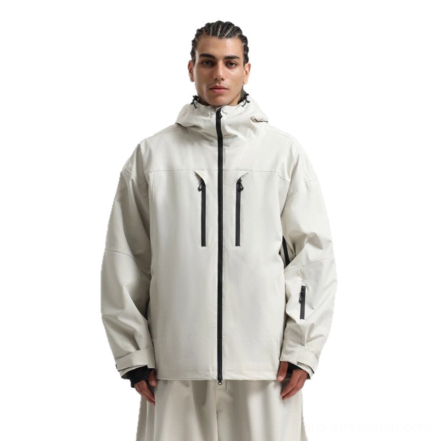 Cream off-white men’s outdoor ski jacket with dual vertical chest pockets, sleeve pocket, and relaxed matching outfit