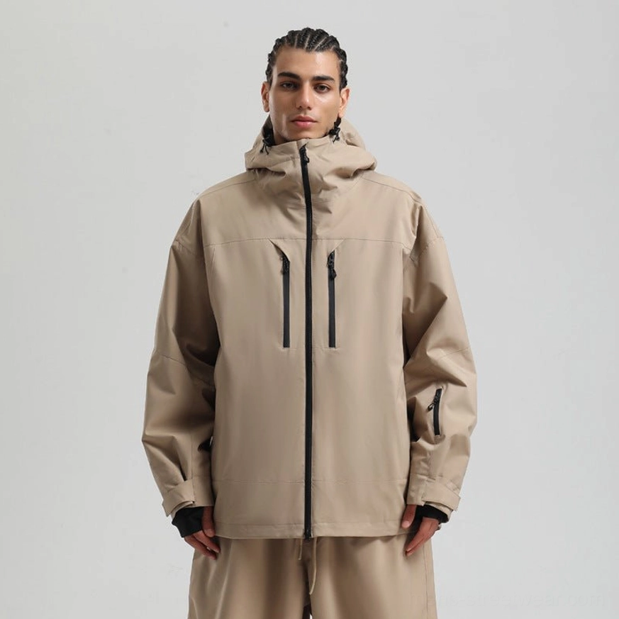 Khaki hooded snowboard jacket with dark zipper details and thumbhole-style cuffs, shown in a relaxed fit