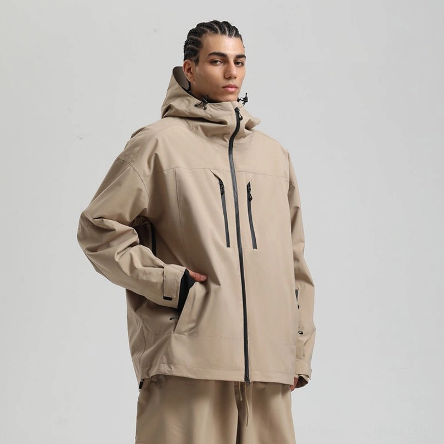 Khaki men’s hooded ski jacket with vertical black chest zippers, relaxed outdoor fit, and matching trousers shown from the side