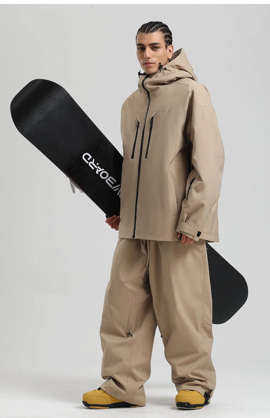 Men’s oversized technical ski jacket featuring a hood, full zip front, and practical snow-ready pocket design