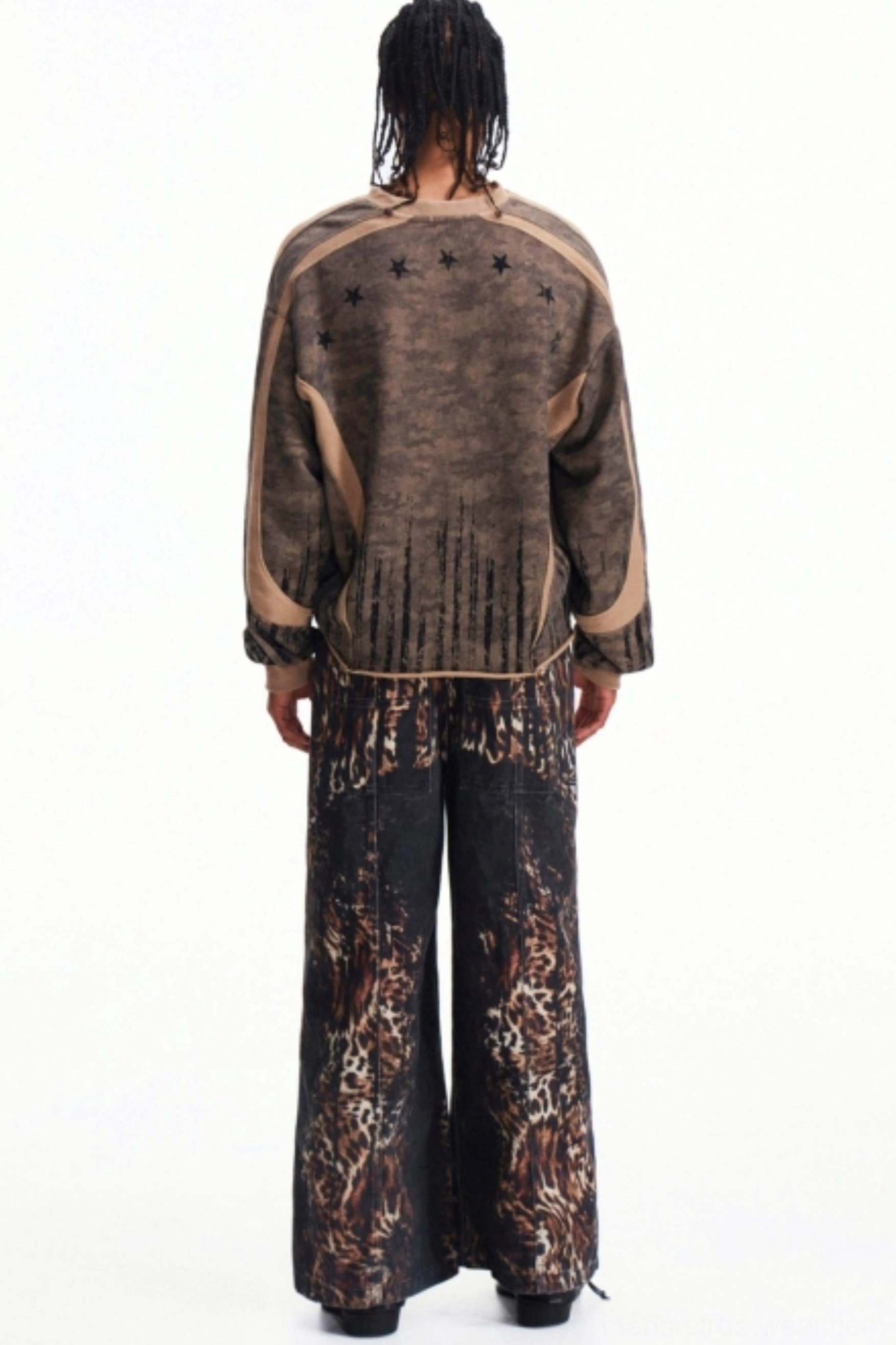 Back view of men's printed half-zip streetwear pullover showing star-inspired upper back detail