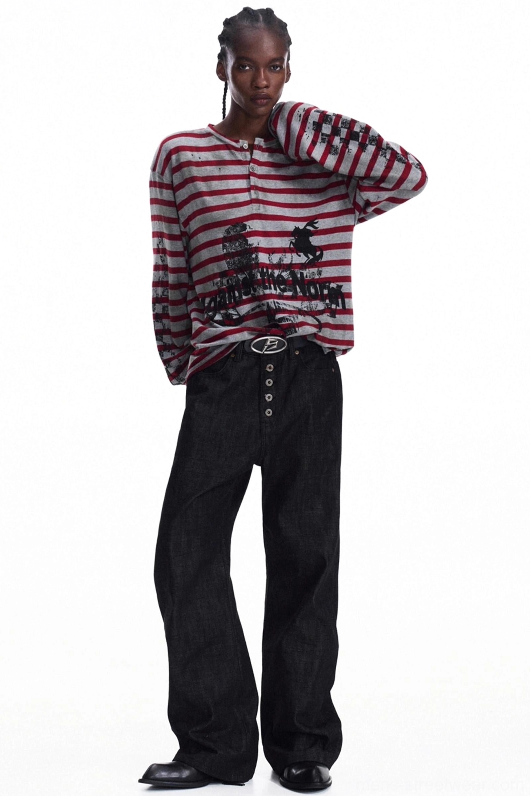 Three-quarter front view of men's red grey striped knit Henley with vintage black graphic print details