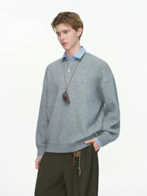 Men's relaxed knit polo sweater styled with wide-leg brown trousers and a long pendant necklace in Korean streetwear fashion