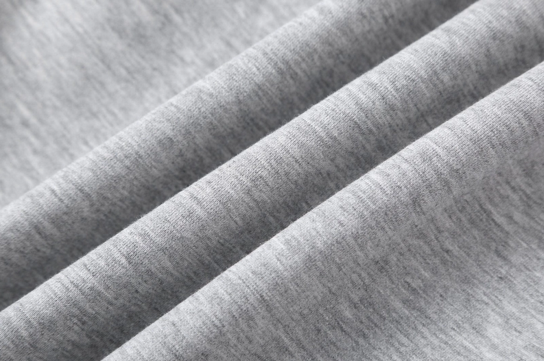 Contemporary slanted panel sweatpants for men featuring a loose fit and versatile streetwear styling