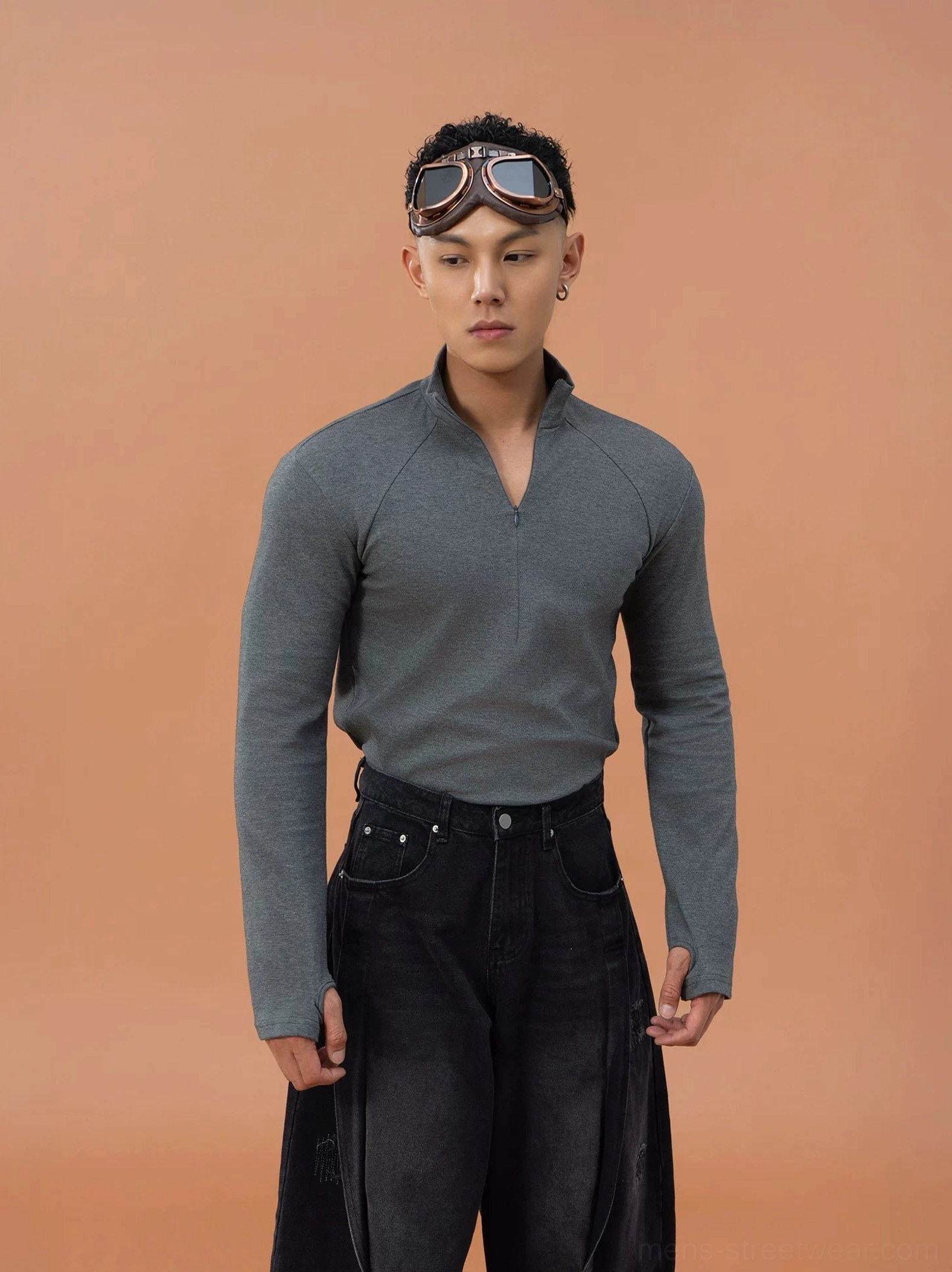 Men's slim-fit quarter-zip stretch top in a solid streetwear color with stand collar and long sleeves