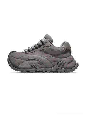 Grey TrailGrid chunky sneakers in left side profile with quilted textured upper, contrast detailing and rugged rubber outsole