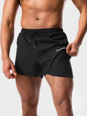 Black men's twin-layer quick-dry swim shorts with built-in liner and adjustable drawstring waist front close-up