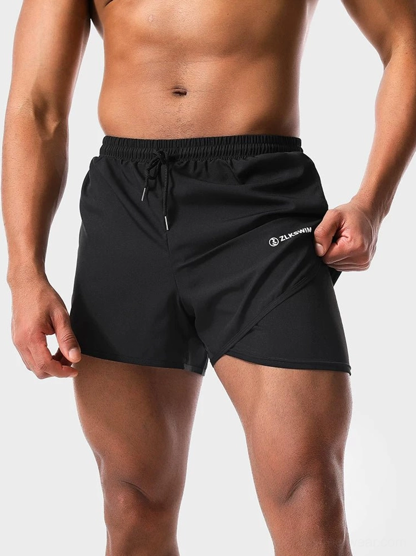 Black men's twin-layer quick-dry swim shorts with built-in liner and adjustable drawstring waist front close-up