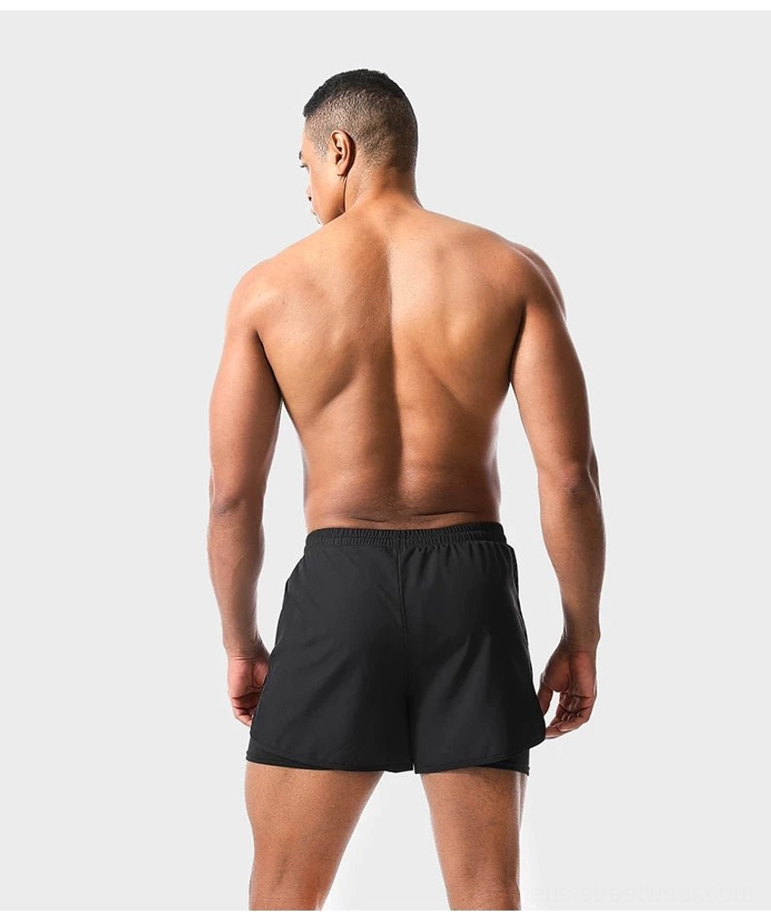 Rear view of black men's twin-layer quick-dry swim shorts showing minimalist double-layer construction
