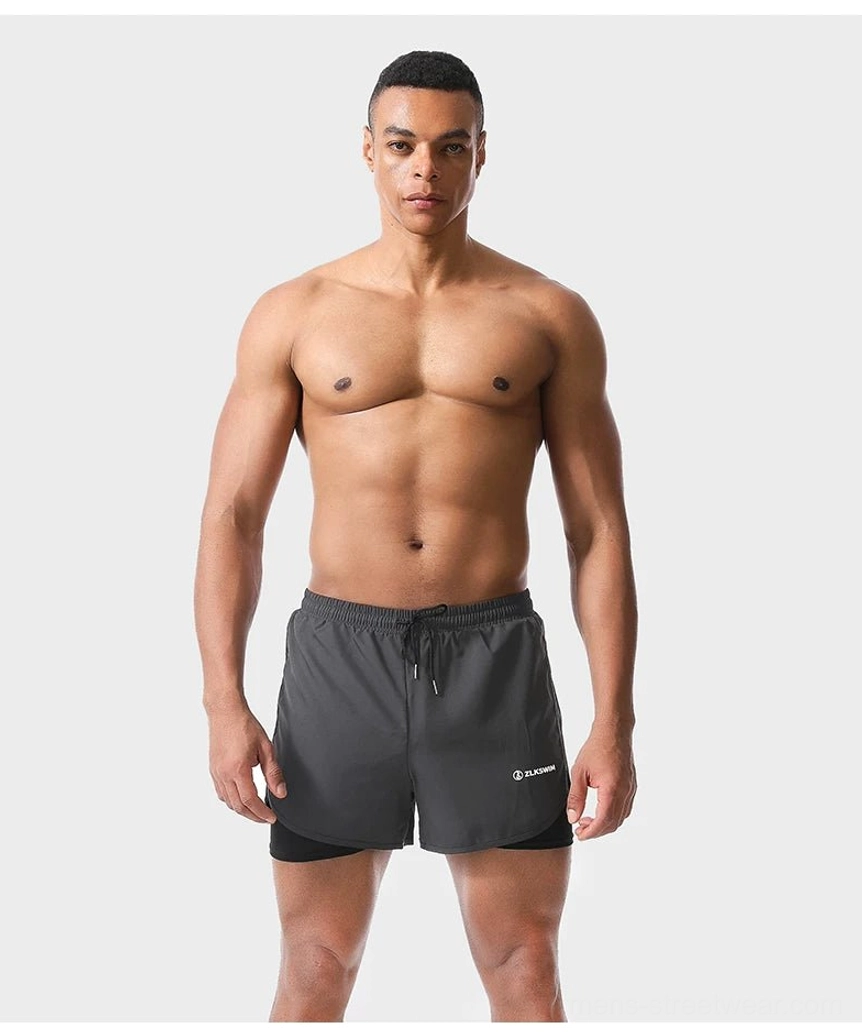 Dark gray men's quick-dry 2-in-1 swim shorts with built-in liner and adjustable elastic drawstring waistband