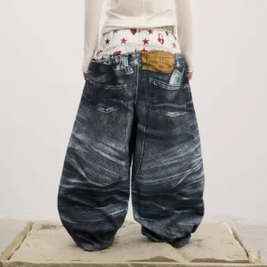Back full-body view of men's ultra-baggy wide-leg denim jeans showing faux back pockets, leather-look tag, dark washed finish, and oversized streetwear silhouette