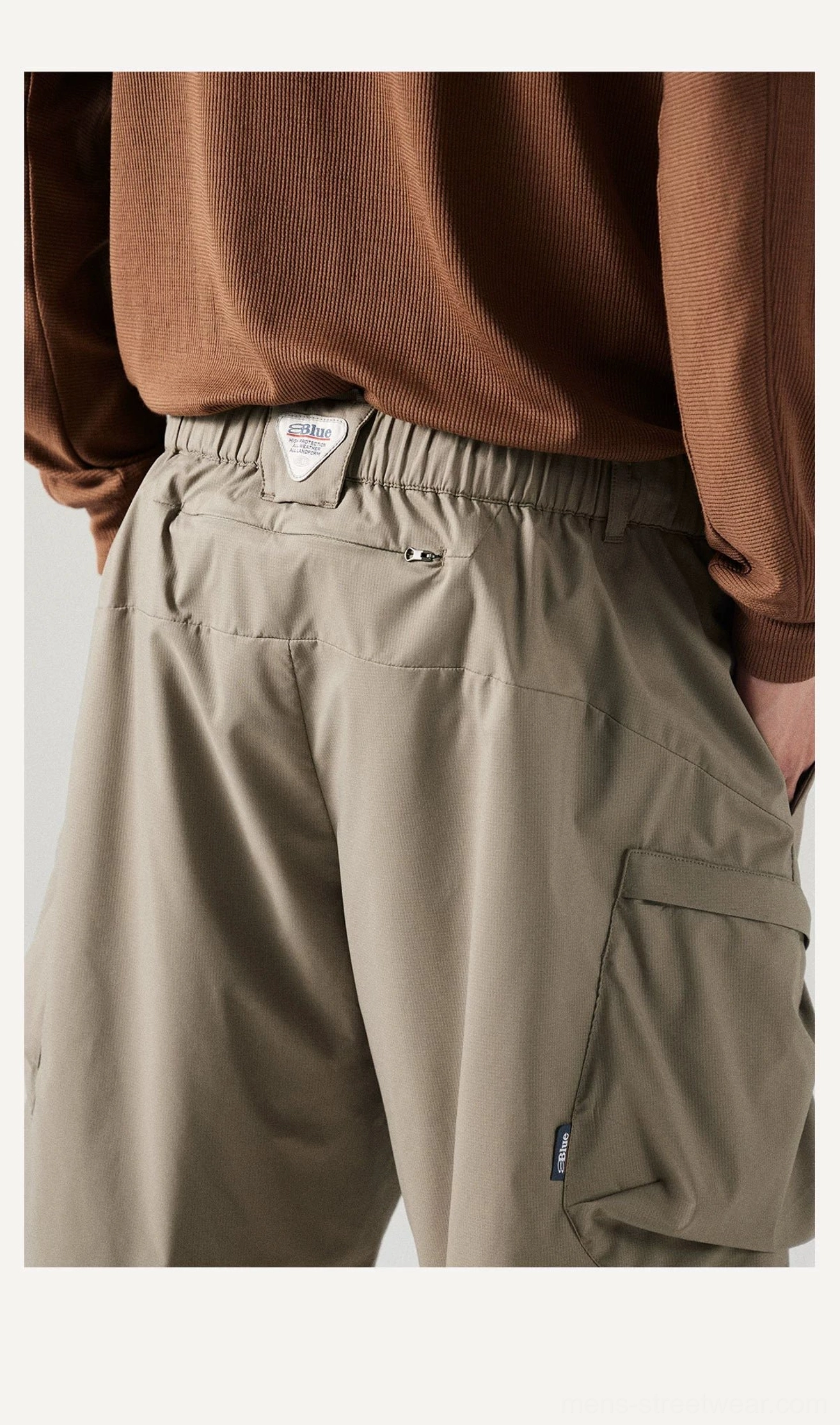 Men's UPF 100+ utility cargo shorts with a loose fit, breathable polyester fabric, and practical outdoor streetwear details