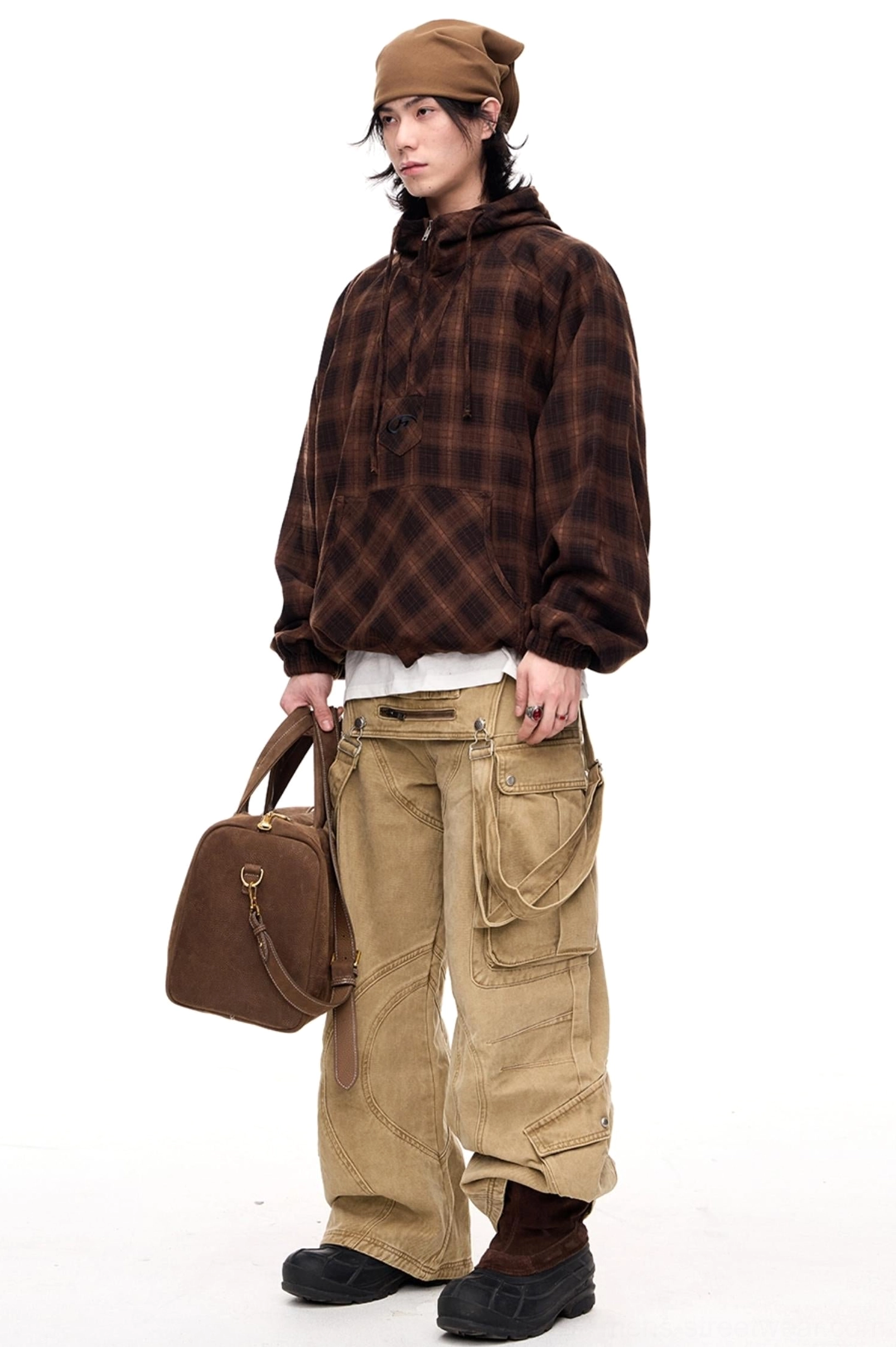 Side three-quarter view of men's vintage washed apricot cargo pants styled without the detachable panel, featuring classic utility pockets and relaxed streetwear fit