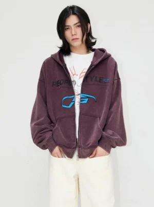 Front view of a men's vintage distressed graphic zip-up hooded streetwear jacket in dusty purple with an oversized relaxed fit and white tee