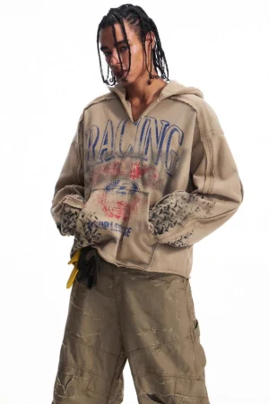 Men's vintage racing graphic oversized khaki hoodie shown from a left three-quarter front view with patterned cuffs, kangaroo pocket, and Korean streetwear styling