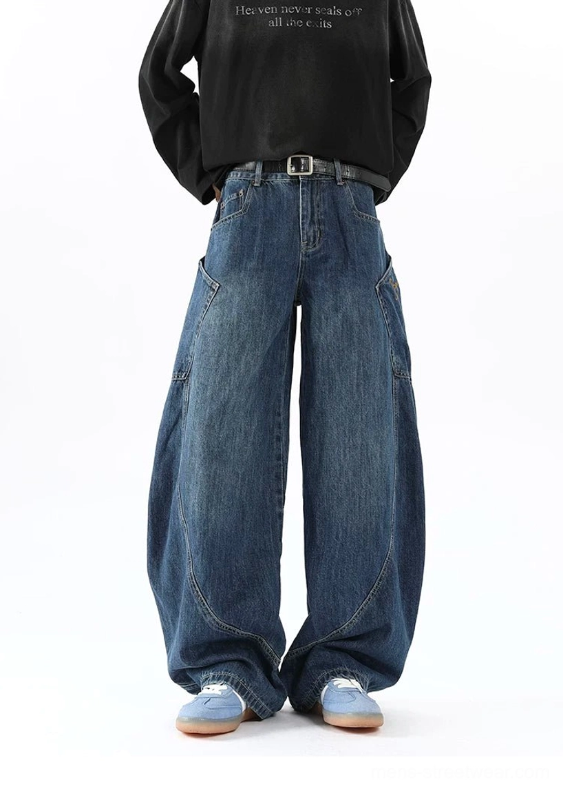Front full-length view of men's vintage wash blue balloon cargo jeans with structured wide leg silhouette and clean denim stitching