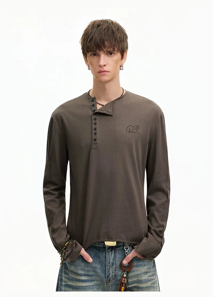 Full front view of a men's washed cotton Henley T-shirt showing the complete button placket and embroidered left chest detail