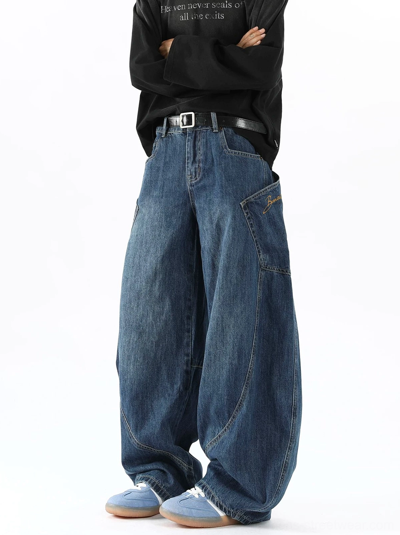 Men's washed indigo balloon denim cargo pants right three-quarter view featuring embroidered side pocket and oversized barrel fit