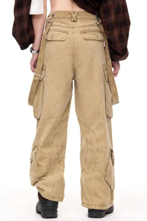 Back view of men's washed khaki wide-leg cargo pants featuring rear patch pockets, curved leg seams, belt loops, and vintage streetwear styling