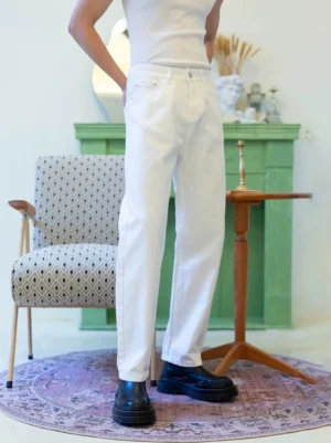 Men's clean white cotton blend straight-leg jeans left side view showing five-pocket denim construction