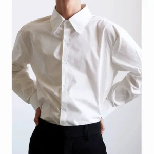 Men's white long-sleeve pointed collar shirt with relaxed tailored fit, smooth cotton texture, visible buttons, and modern Seoul fashion styling