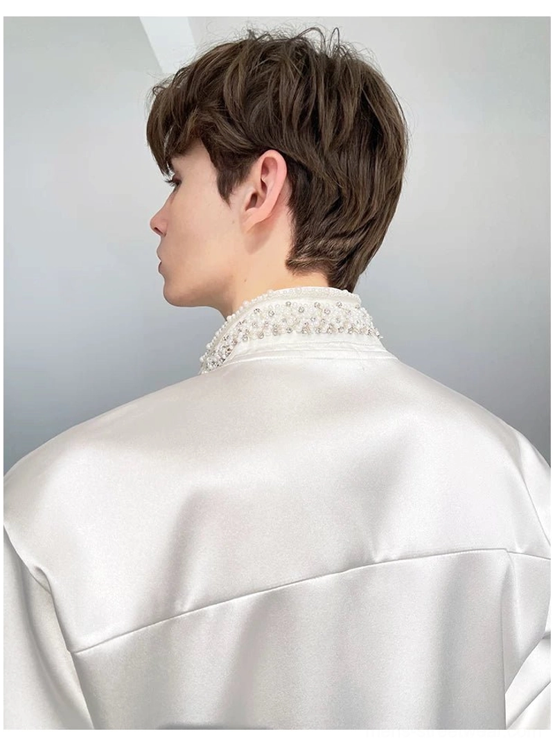 Back view of men's white satin embroidered shirt showing the clean smooth back panel and beaded stand collar