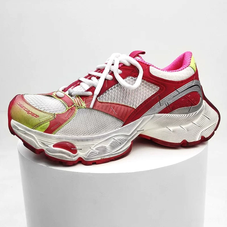 Metallic chunky mesh techwear sneakers product image with reflective synthetic overlays, structured heel, breathable mesh upper, and thick traction outsole