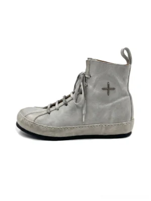 Metallic grey pointed-toe lace-up streetwear boots shown from the left side with a distressed finish, ankle cross ornament, stacked heel, and rear pull tab
