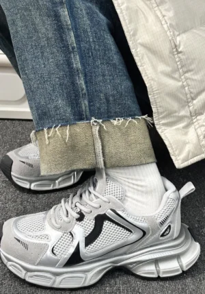Retro metallic mesh runner sneakers worn with rolled jeans and white socks in a casual Korean streetwear outfit