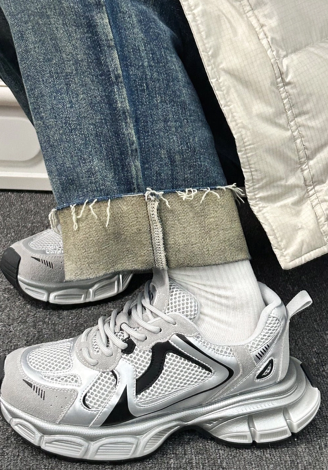 Retro metallic mesh runner sneakers worn with rolled jeans and white socks in a casual Korean streetwear outfit