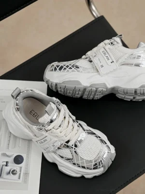 Pair of metallic silver mesh chunky tech runner sneakers shown from above with breathable mesh upper and layered streetwear details