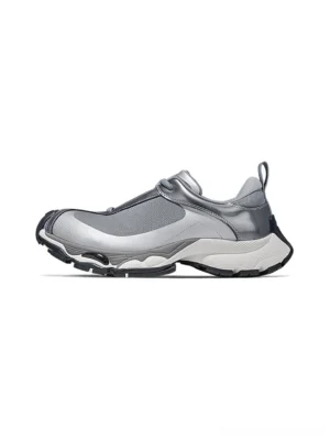 Metallic silver split-toe technical runner sneaker in a left front three-quarter studio view with layered mesh panels, glossy overlays, and chunky black-white outsole