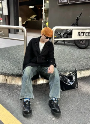 Metallic stardust chunky lug sole derby shoes worn with casual streetwear outfit at an outdoor urban cafe